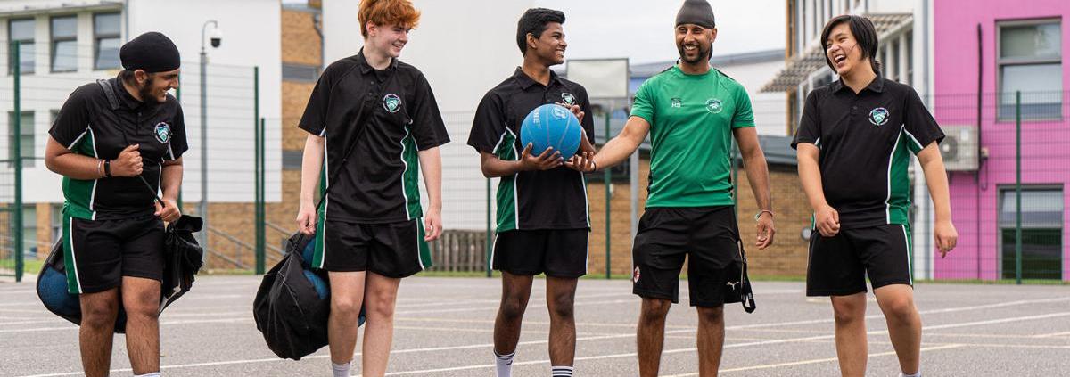 Mr Sagoo with students on MUGA