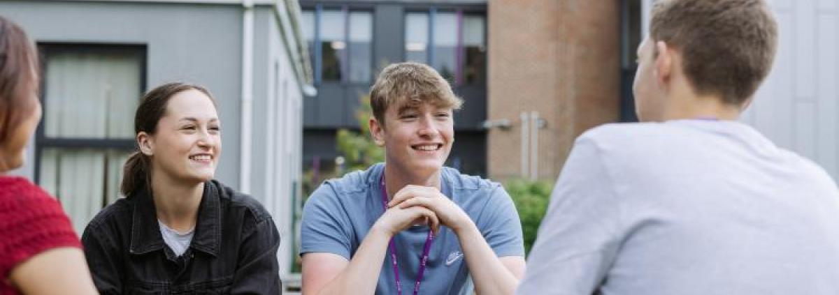 Students at BCoT sitting outside